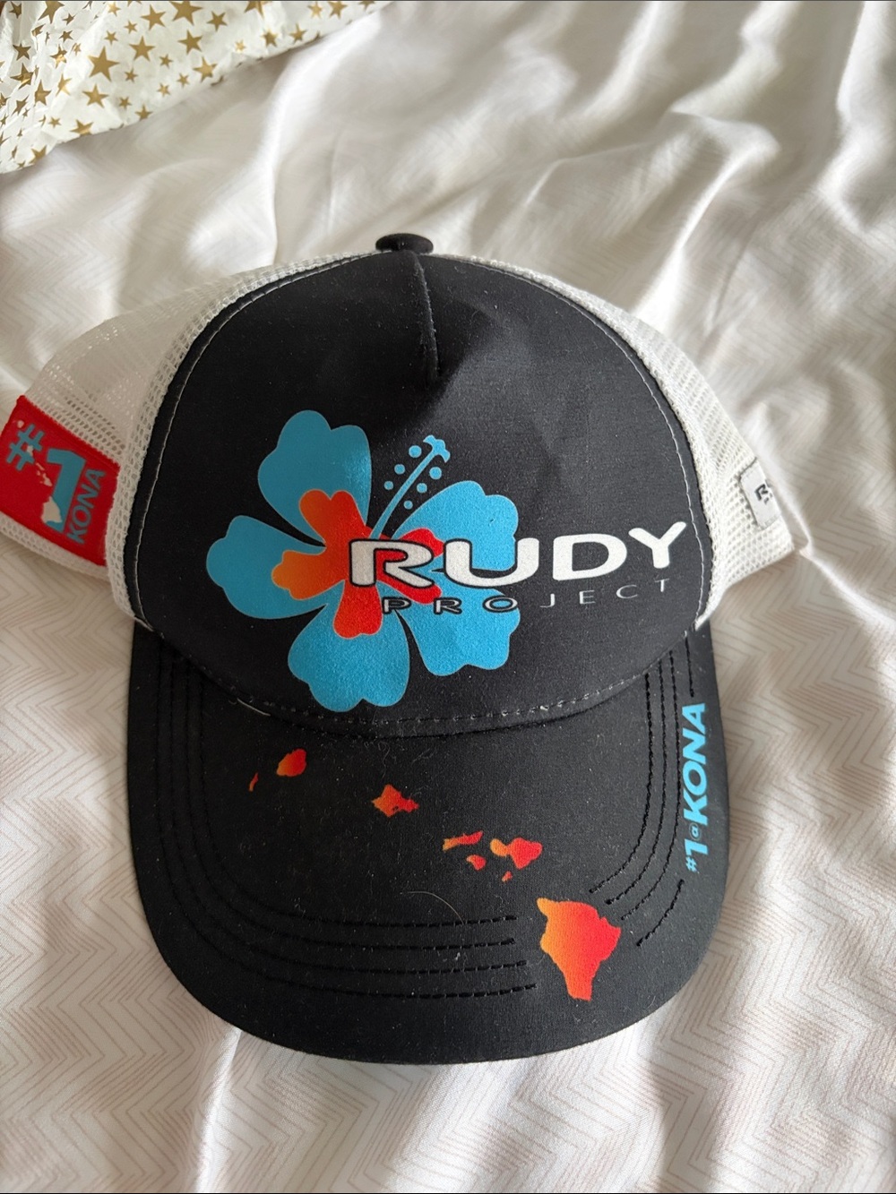 Rudy Collection Kona Black Mesh Trucker Hat with Blue Hibiscus